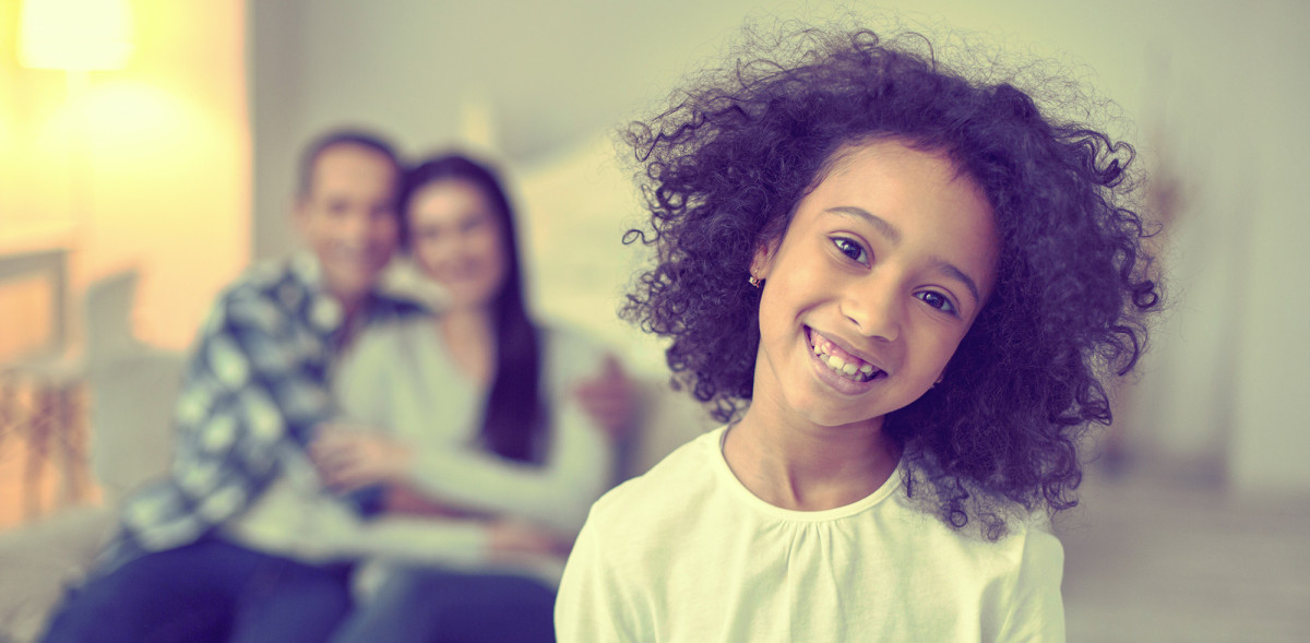 Kid Smiling with Couple