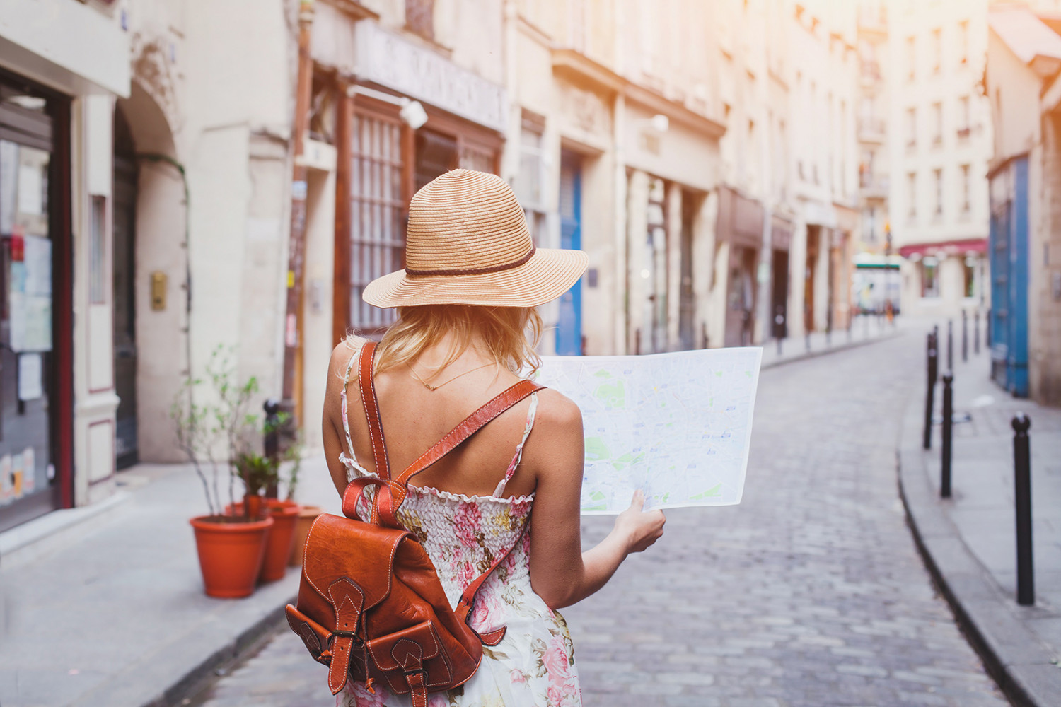 Woman tourist with map on the street