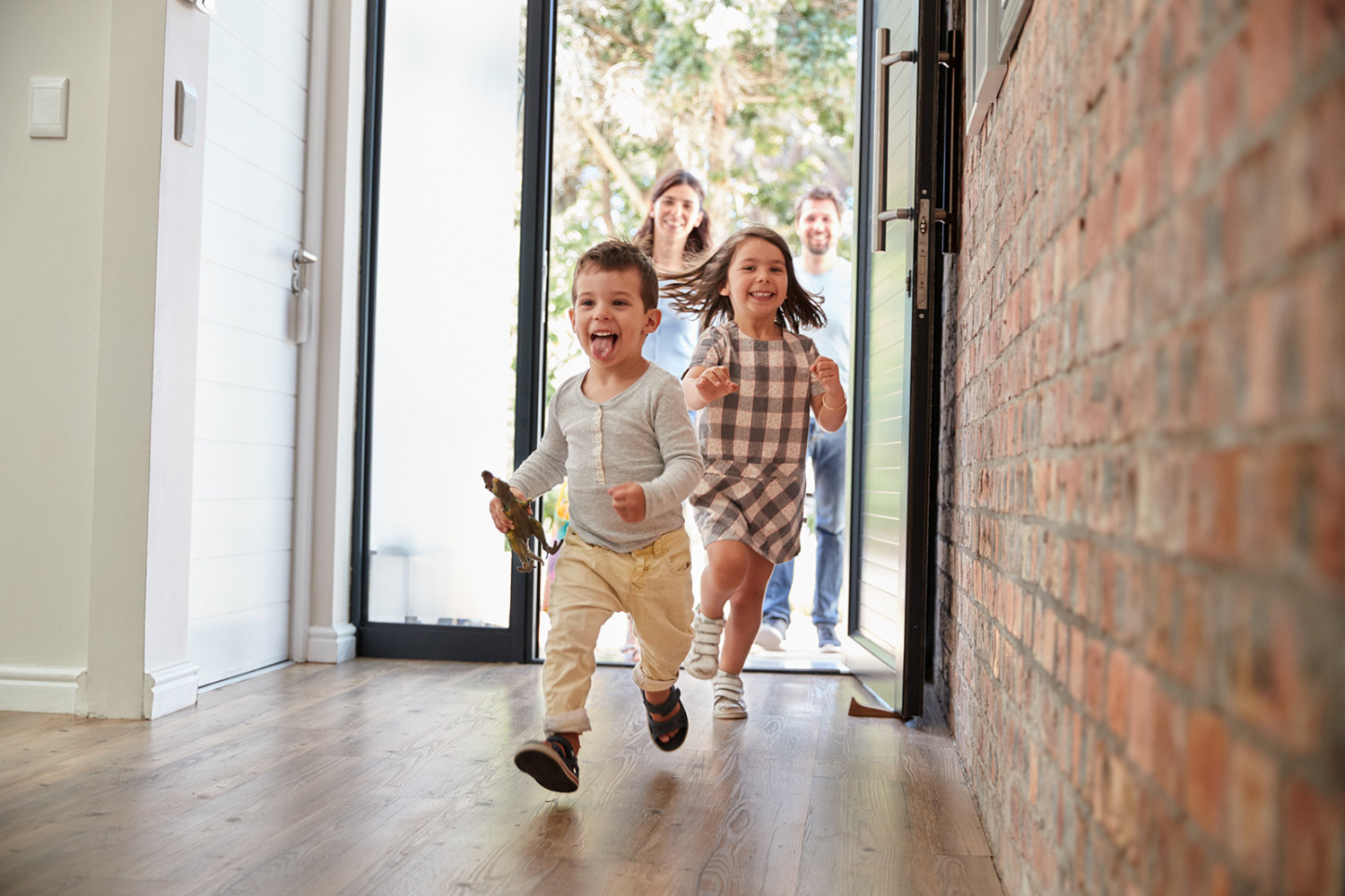 Excited Children Arriving Home with Parents