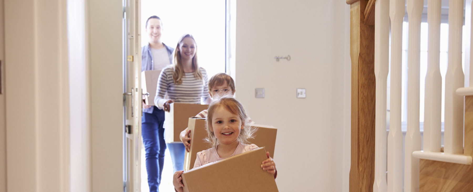 Family Moving Into House