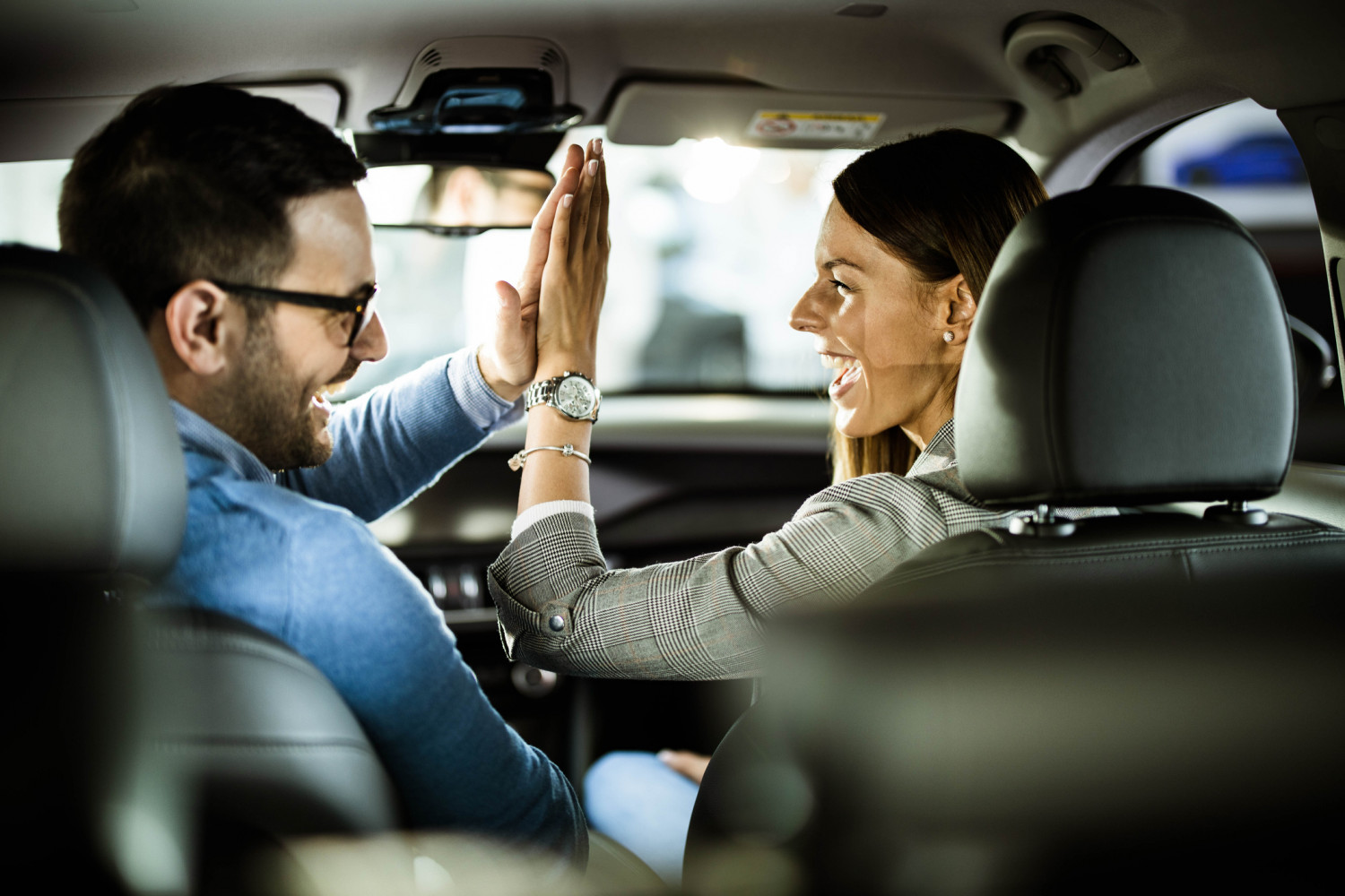 Excited couple in car