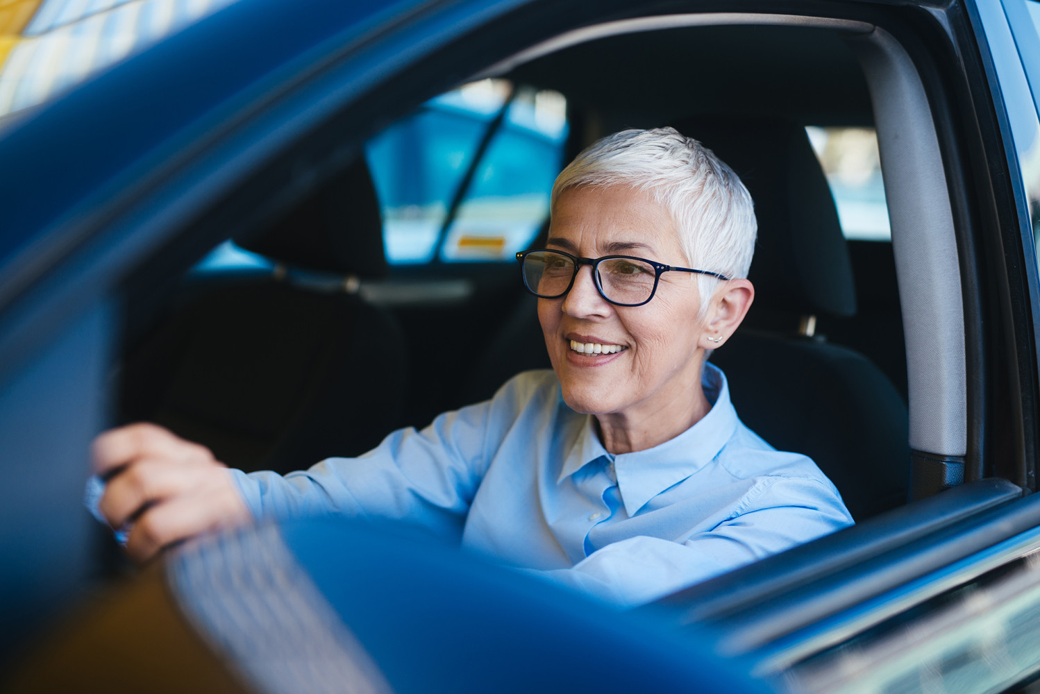 Auto - Elderly Female Driving Smiling