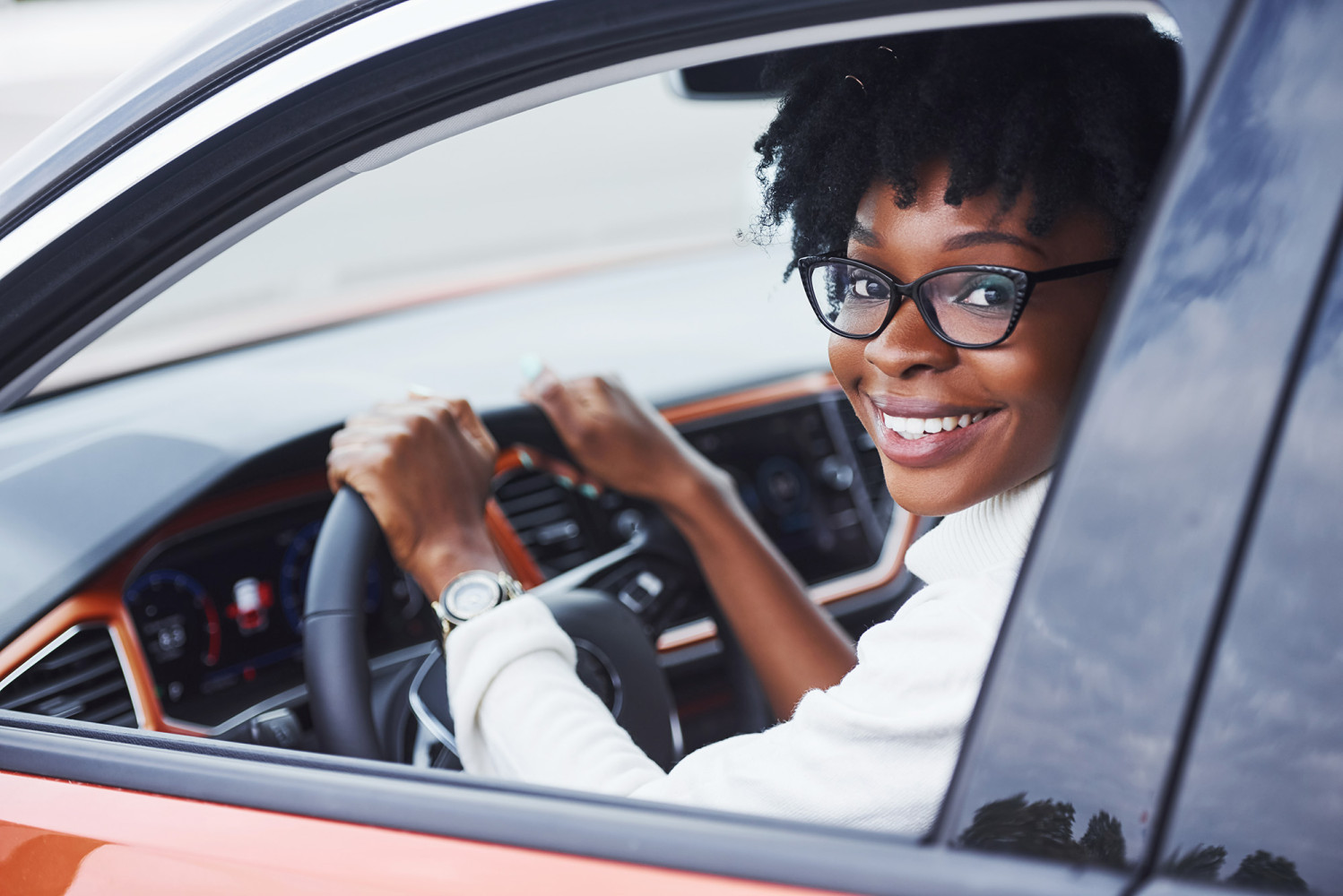 Driving - Woman smiling red car