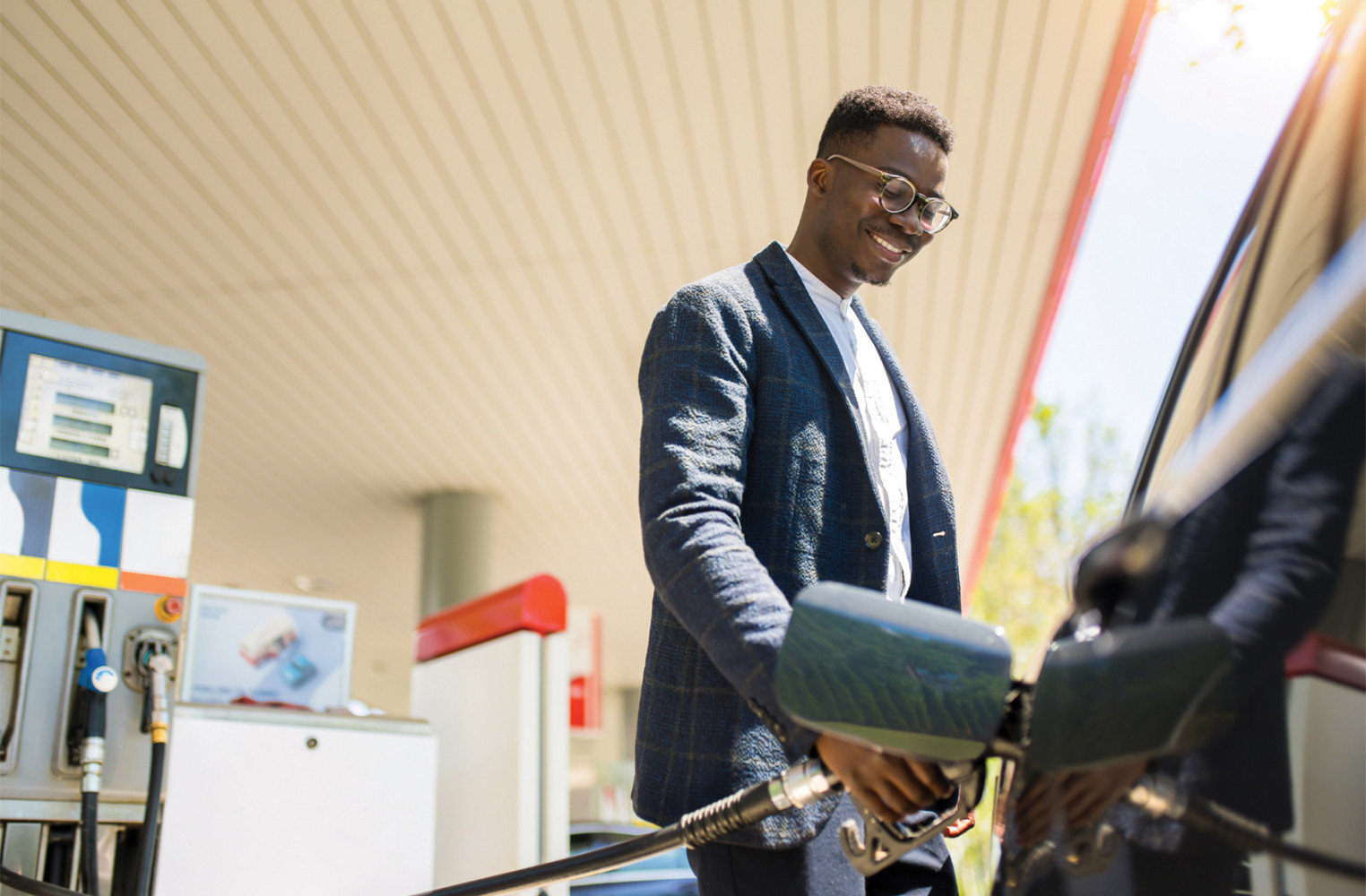 Gas - Man adding gas