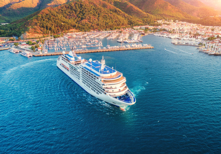 Cruise ship at harbor. Aerial view of beautiful large white ship at sunset.