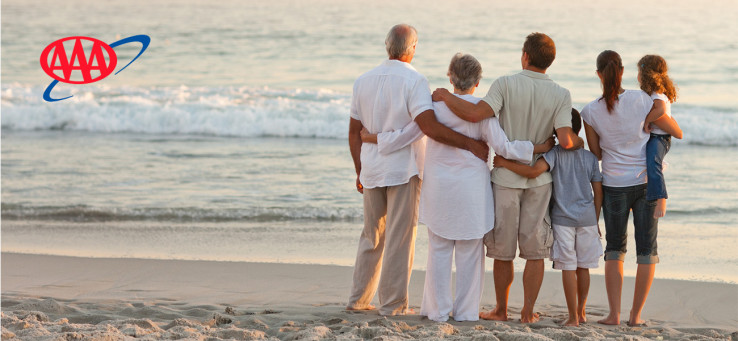 Family watching the sunset on the beach