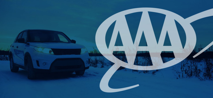 Car on a snowy landscape with AAA's logo