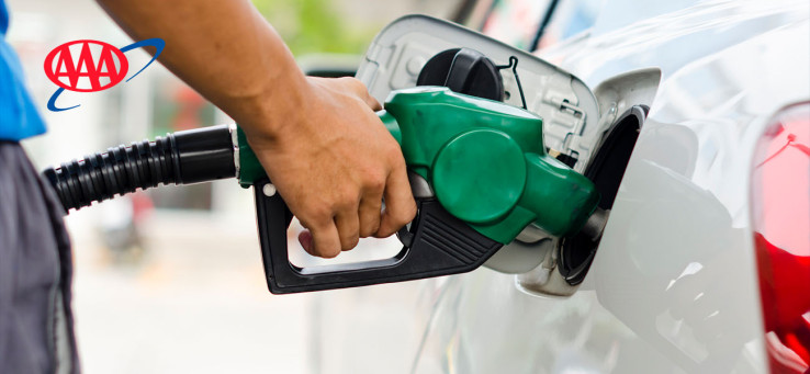 A man pumping gas into his car