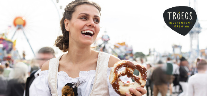 Woman holding pretzel in germany