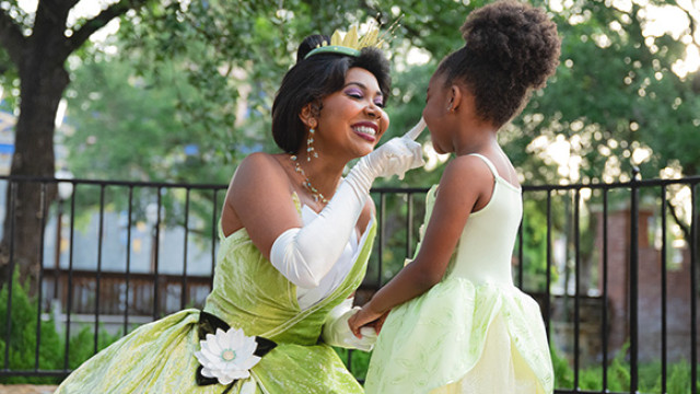 Princess Tiana interacting with a little girl