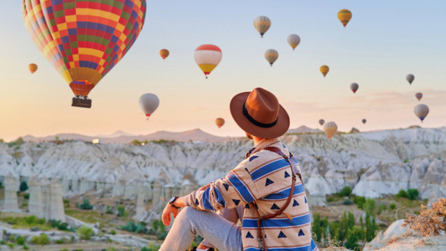 Man watching hot air balloons