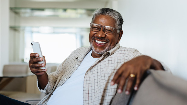 Man with Phone Smiling
