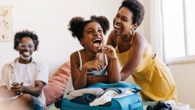 family packing suitcase