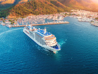 Cruise ship at harbor. Aerial view of beautiful large white ship at sunset.