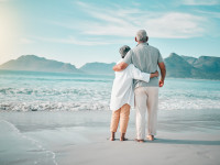 Couple enjoying retirement carefree on a white sandy beach