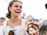 Woman holding pretzel in germany