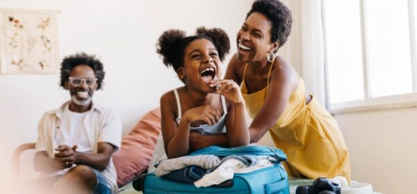 family packing suitcase