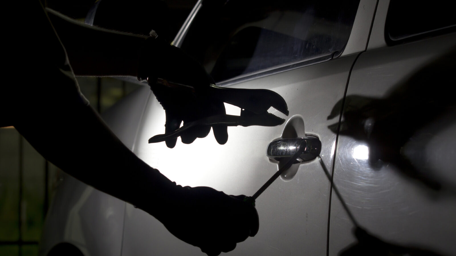 car being broken into with tools
