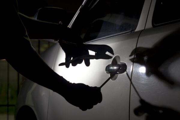 car being broken into with tools