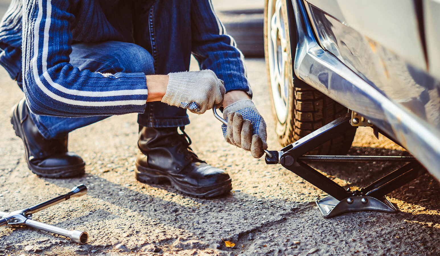 a photo of a vehicle getting its tire changed