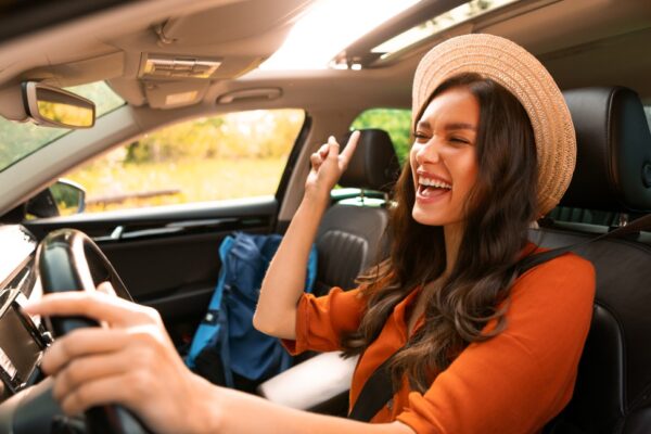 Young adult woman driving