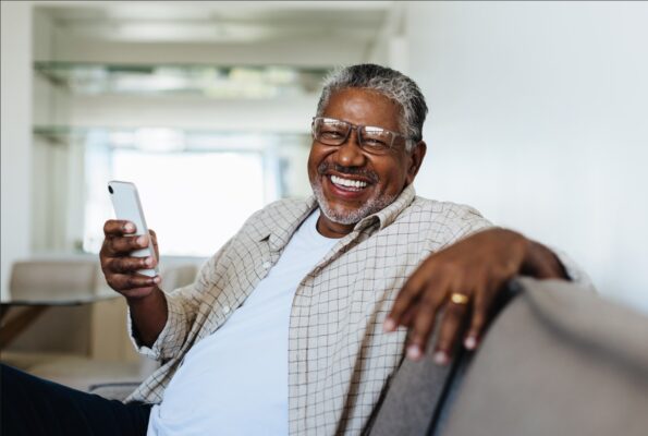 Man with Phone Smiling