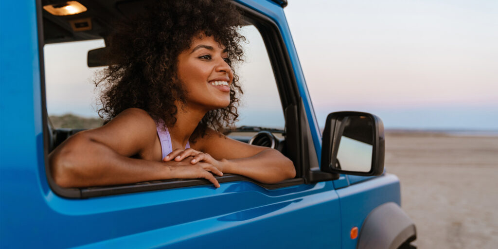 woman smiling out of car window