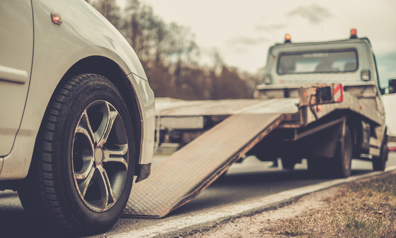 photo of car getting towed
